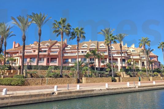 Unfurnished luxury first floor apartment with fabulous southerly views directly over the Marina to the sea