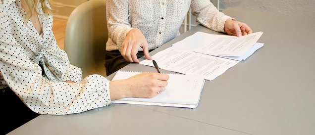 closup image of a couple of women going over property documents, featured image for the article 