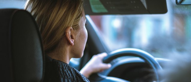 a woman driving, featured image for the article 