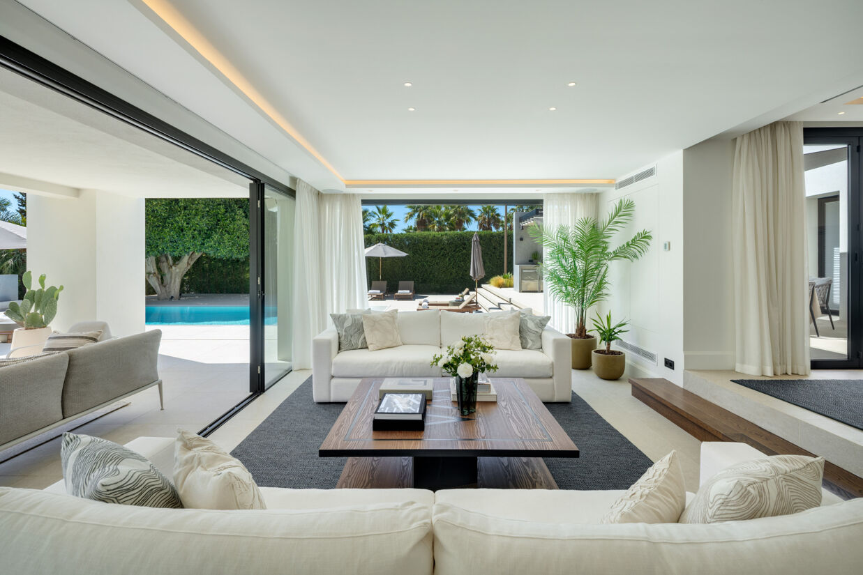 Interior of a Marbella luxury villa with natural light, sustainable materials, and minimalist Mediterranean design.