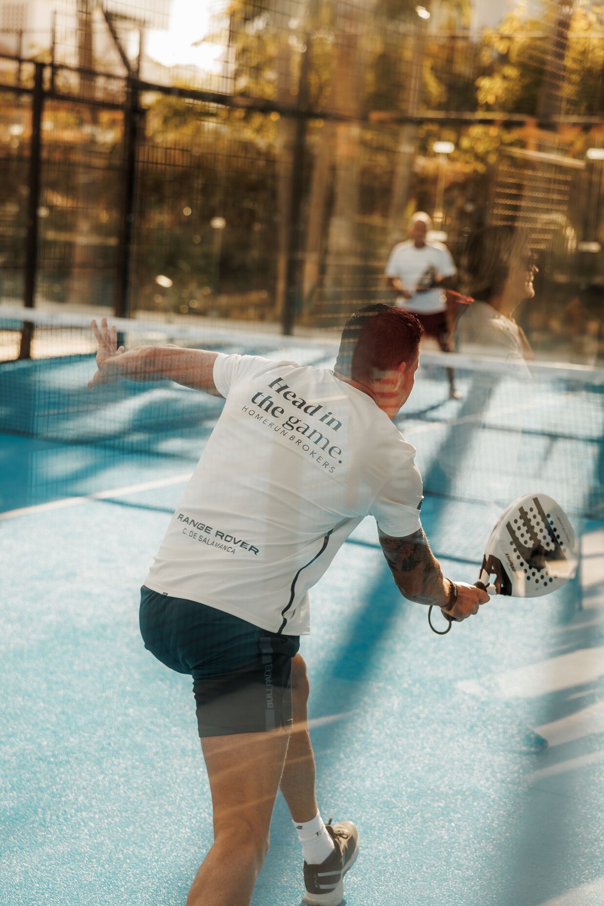 Padel player in action at Nueva Alcántara Club, Marbella, during the Homerun Brokers x Range Rover event.