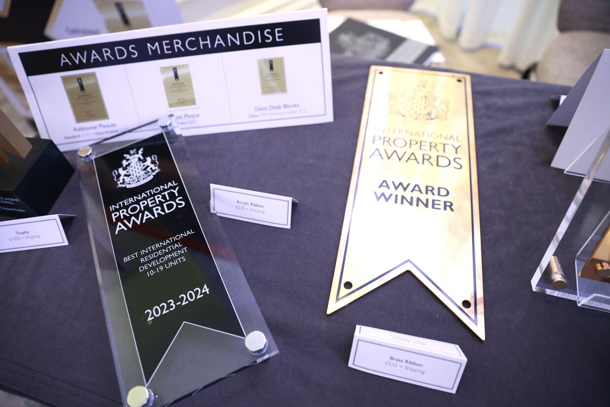 European Property Awards 2025–2026 trophies and plaques displayed at the award ceremony.