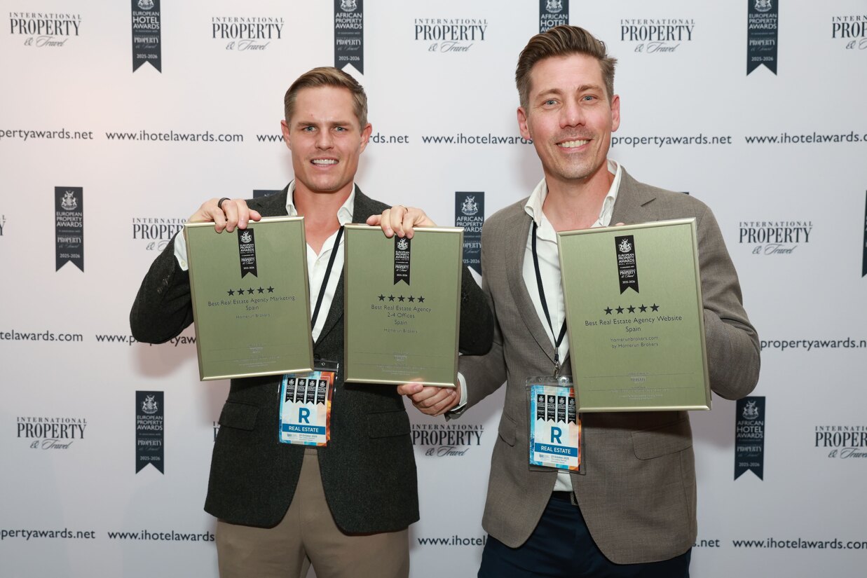 Eric Ebbing and Roger Widén from Homerun Brokers holding three European Property Awards for Best Real Estate Agency, Marketing, and Website in Spain.