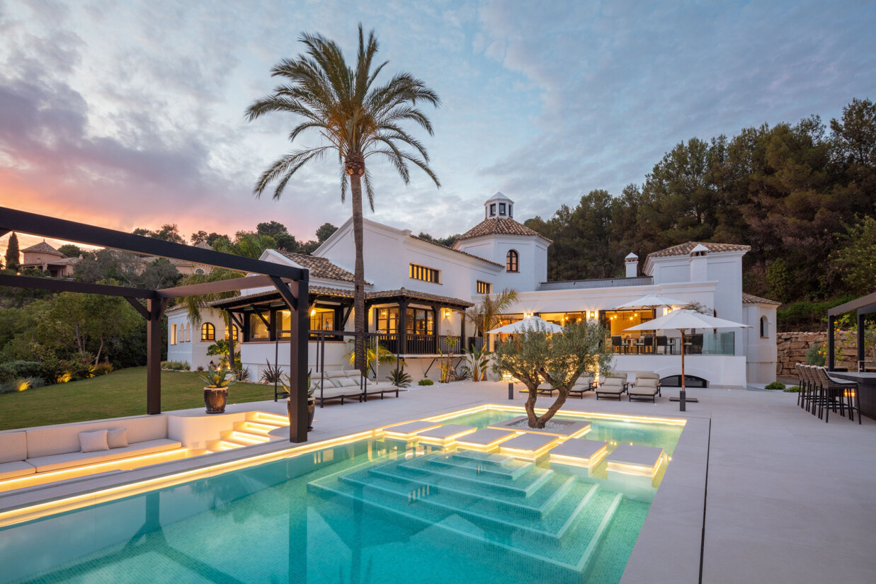 Luxury villa in La Zagaleta with Mediterranean architecture, landscaped gardens, and panoramic sea and mountain views.