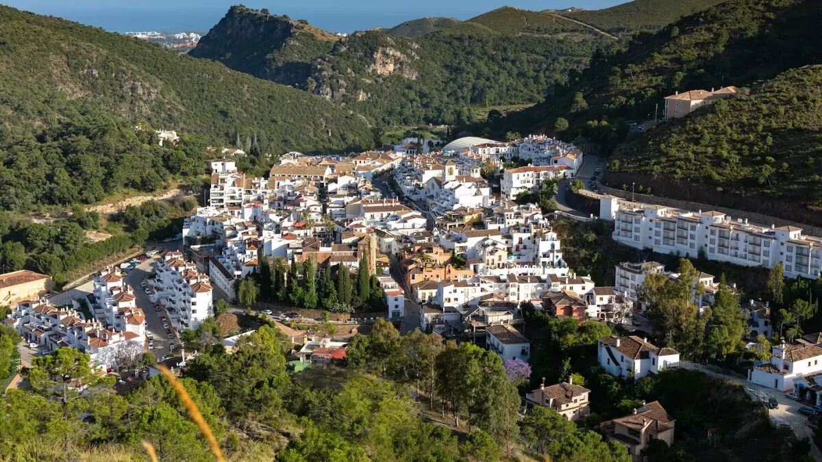 Aerial view of Benahavís village near Marbella, known for gastronomy and luxury real estate in the surrounding hills.