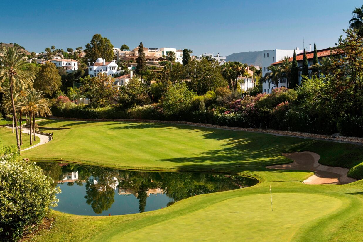 Golf course in Marbella surrounded by greenery and luxury villas