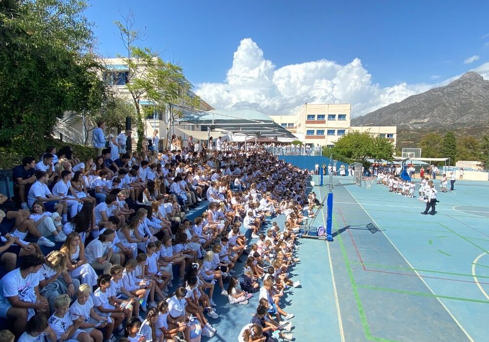 International school campus near Marbella with students gathered outdoors, highlighting family lifestyle in Benahavís.