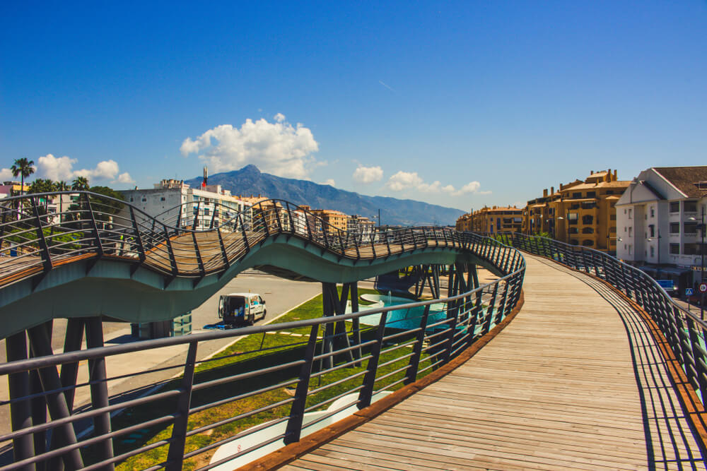 Modern pedestrian walkway in San Pedro de Alcántara with mountain views