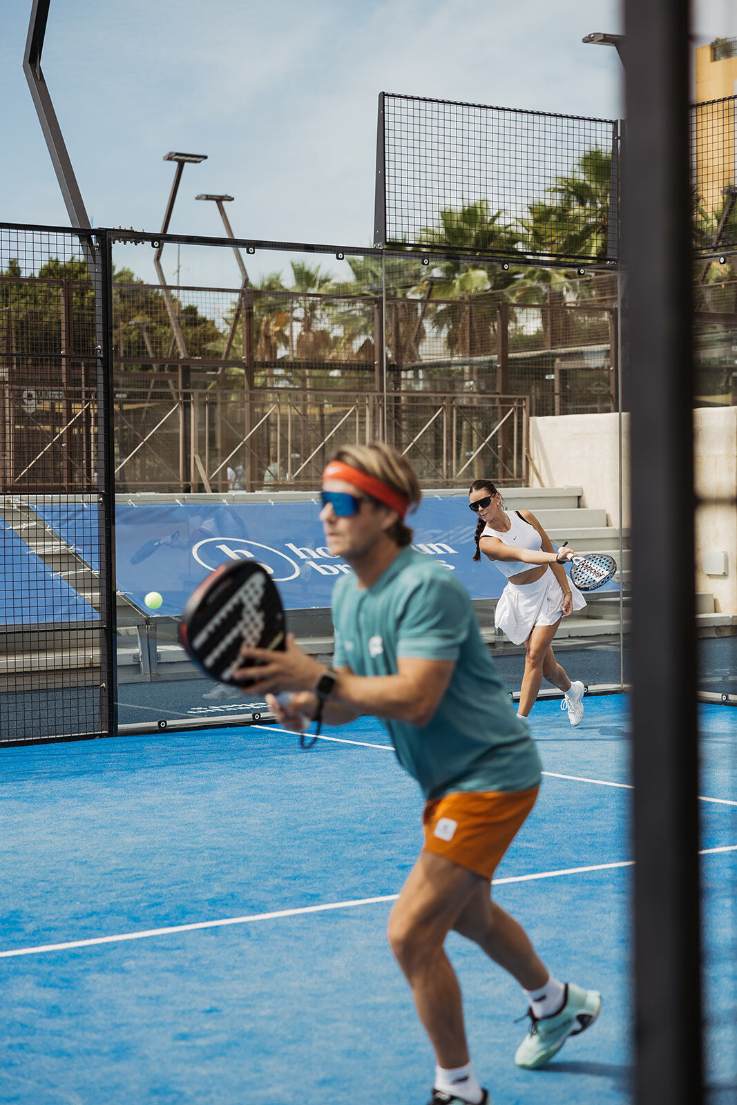 Padel players competing in a match at Nueva Alcántara Club during the Homerun Brokers annual tournament in Marbella.
