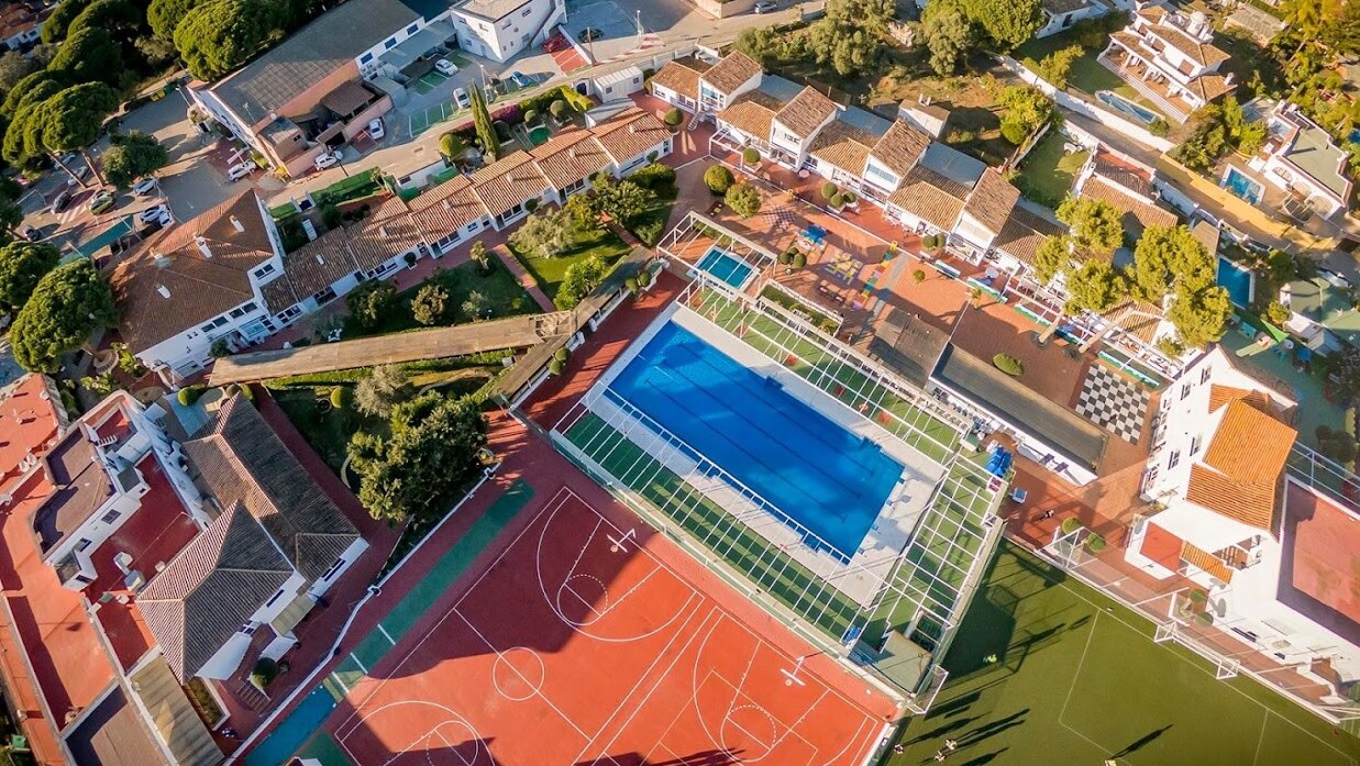 EIC Marbella Campus – Outstanding sports facilities including a 25m pool, astroturf pitch, volleyball, basketball & climbing wall for top-tier physical education.