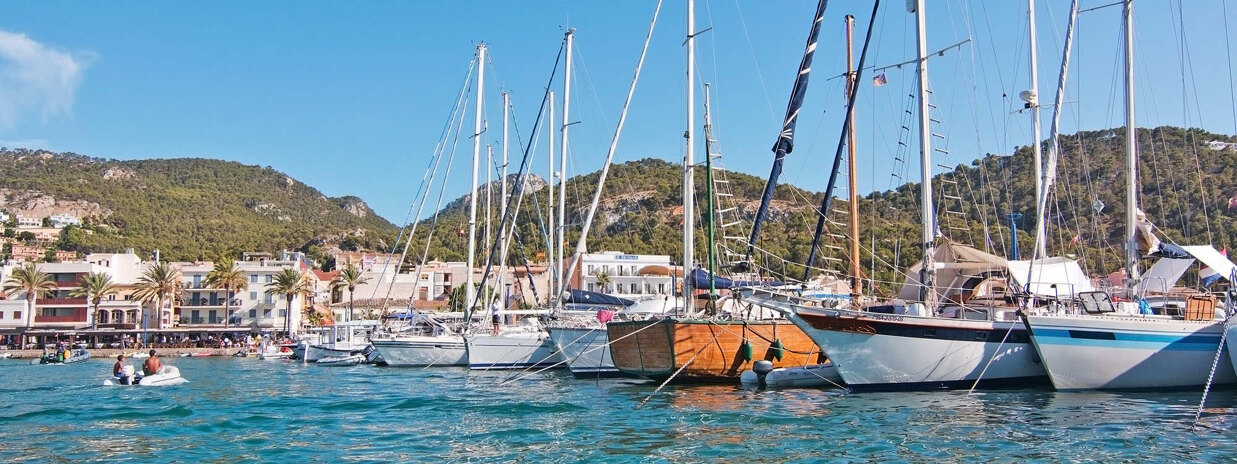 Marina in Port Andratx with yachts and pier in an elegant coastal setting.