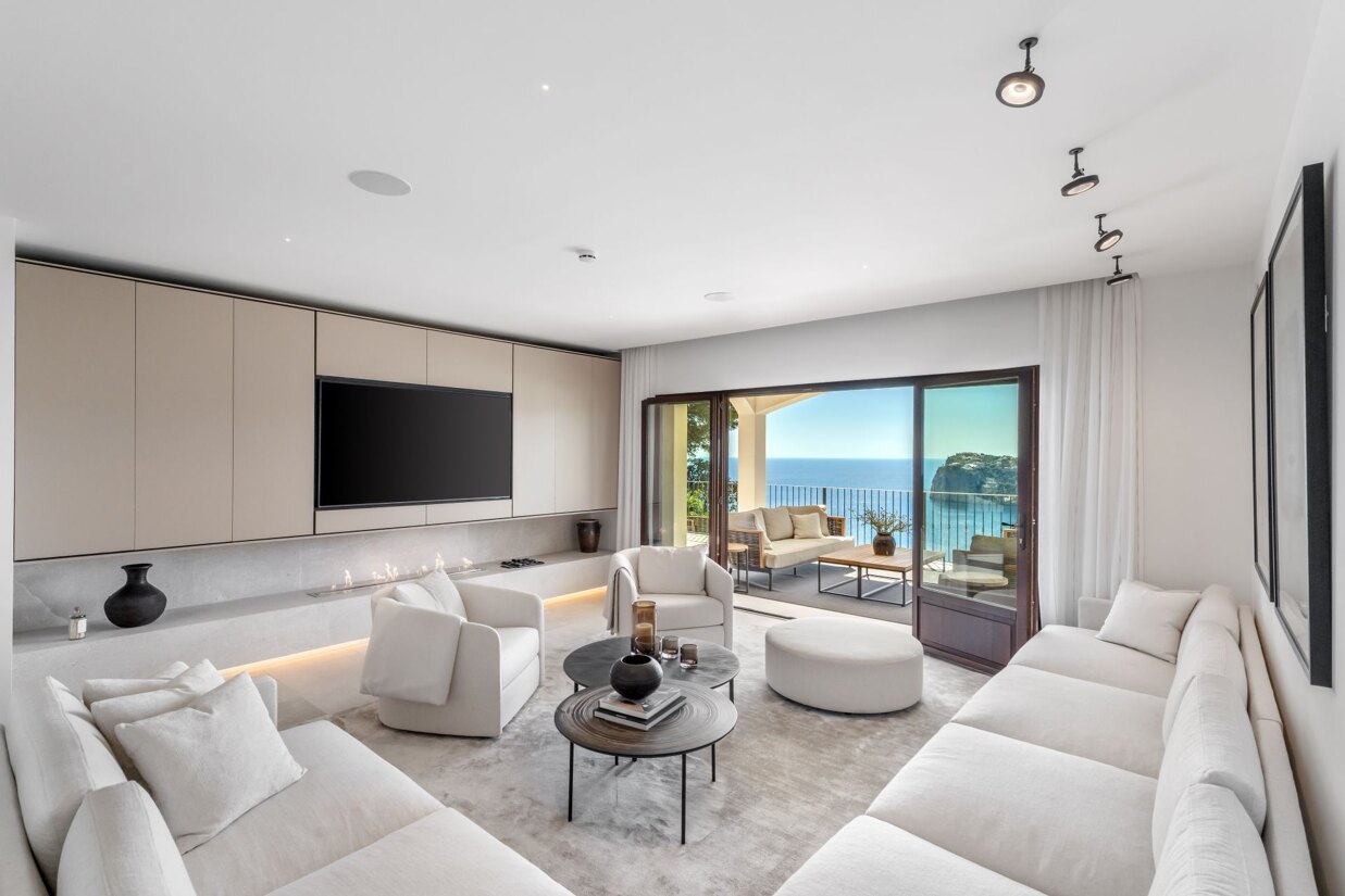 Light-filled living room at Villa Escape featuring contemporary architecture and panoramic Mediterranean views in Mallorca.