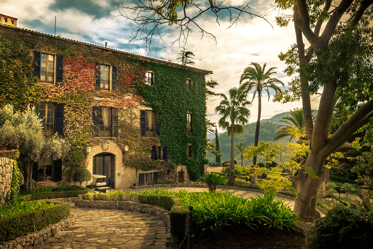 Elegant hilltop hotel blending historic charm and modern luxury in the Mallorcan countryside.