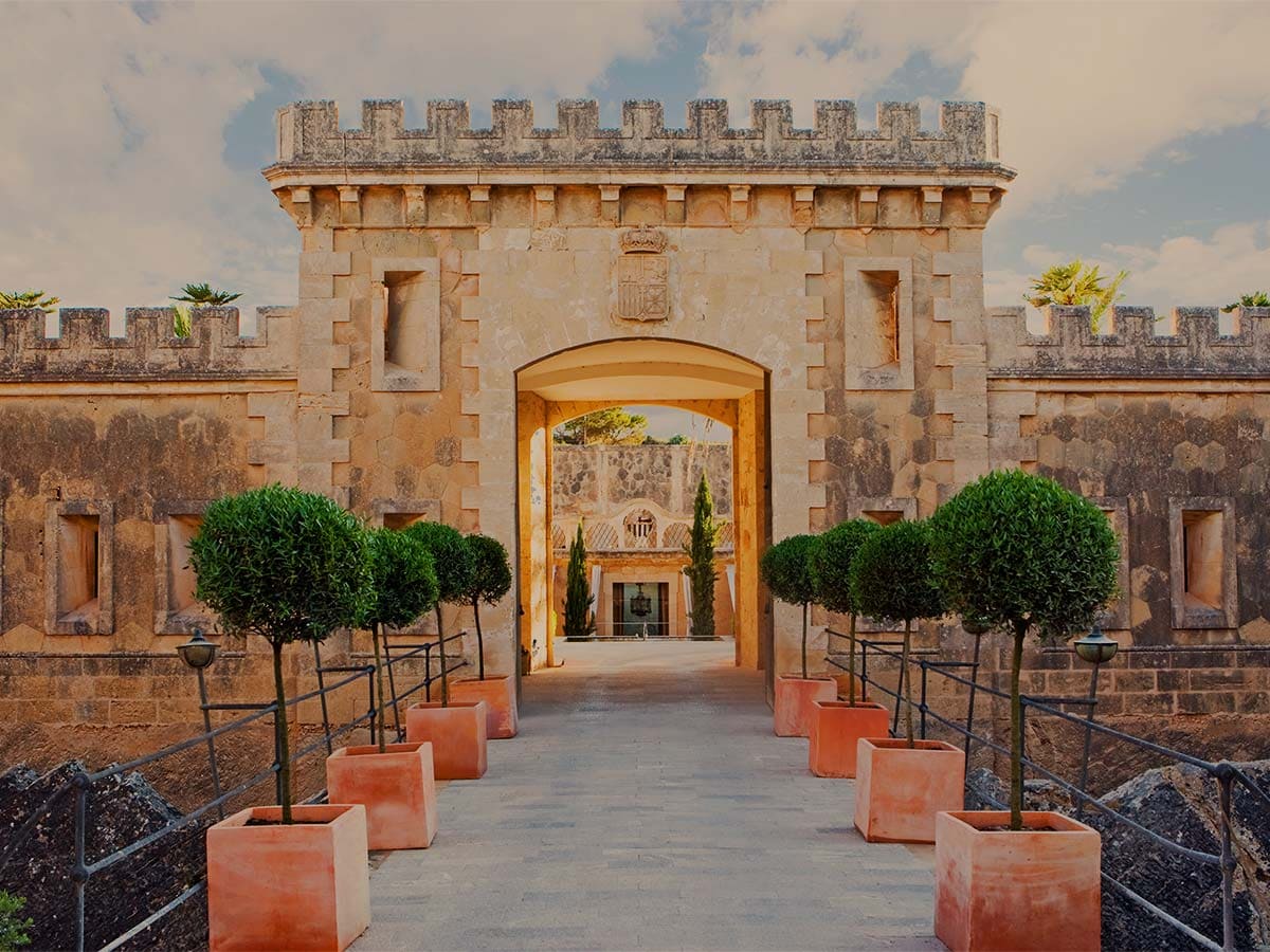 Luxury seaside hotel highlighting serene architecture and exclusive coastal atmosphere in Mallorca.