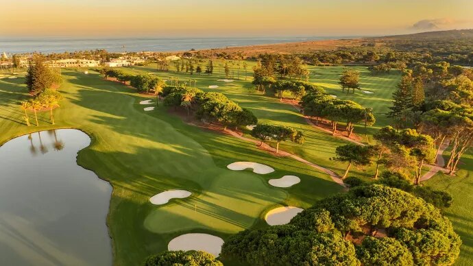 Panoramic sunrise view of Sotogrande Real Estate Market 2025 with golf courses, marina, and Mediterranean Sea.