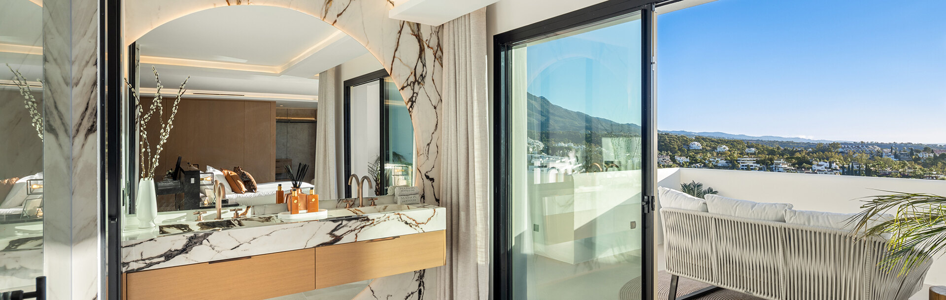 The master bathroom and adjoining terrace of the master suite in Maison Montaigne, developed by Homerun Developments and sold by Homerun Brokers