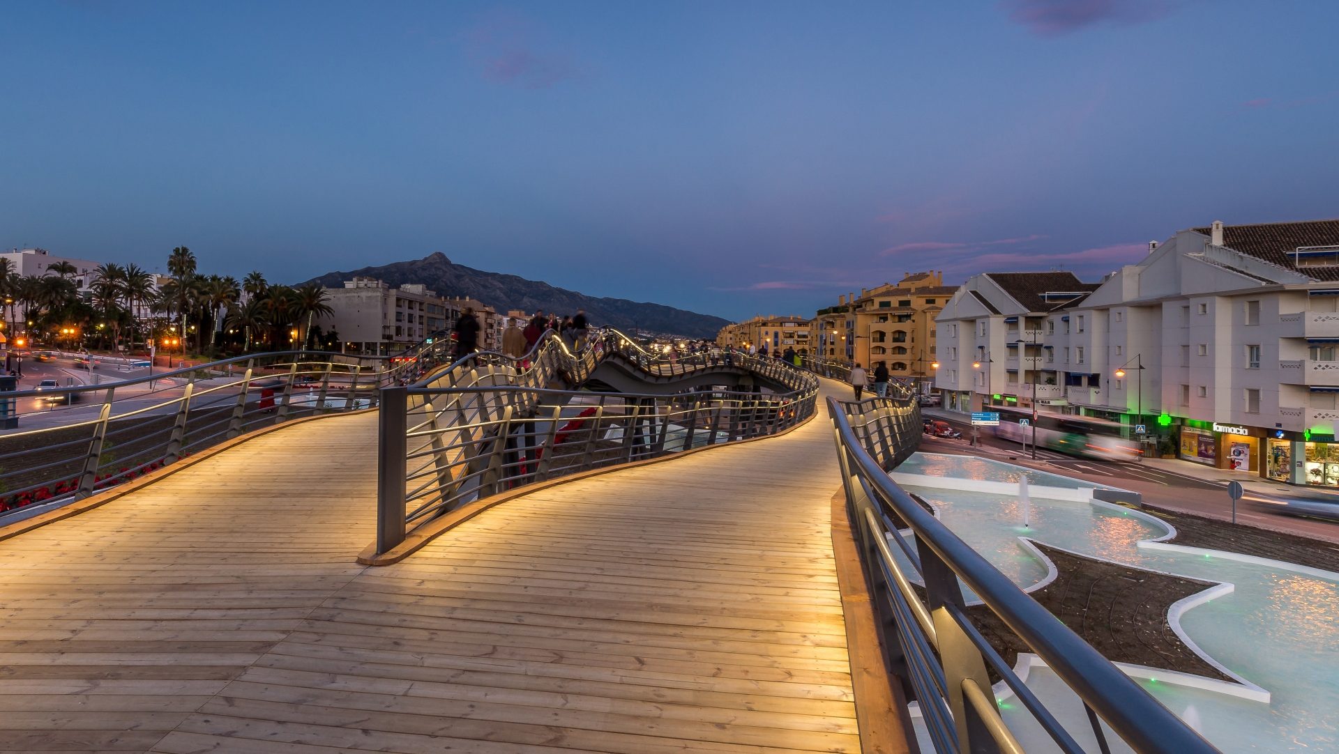 San Pedro Alcántara – A coastal town blending Andalusian charm with modern living. The Boulevard, with its iconic wavy bridge, is the heart of local life, connecting cafés, playgrounds, and open-air events.