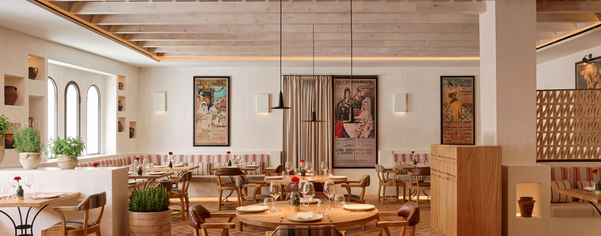 Wooden tables and chairs at El Pimpi restaurant