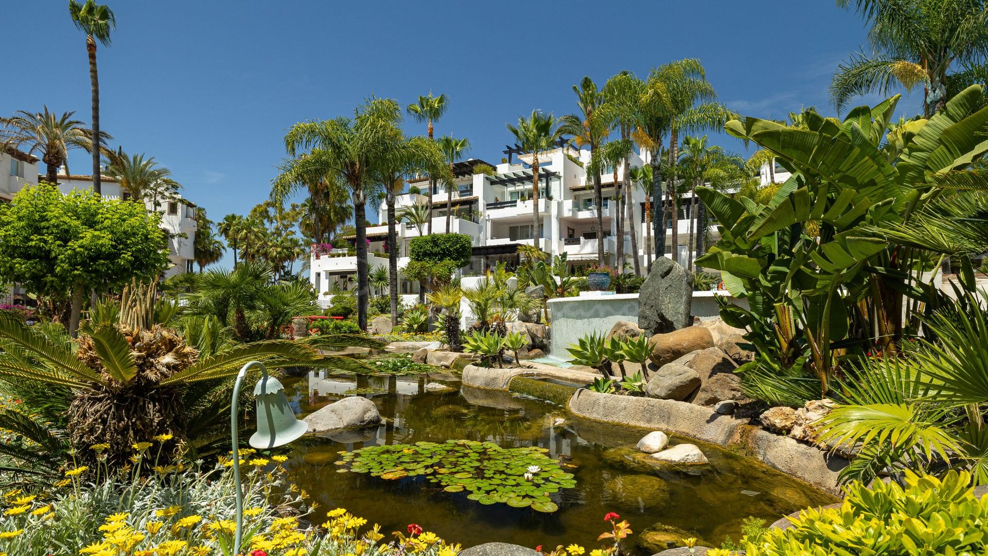 Puente Romano Marina Andalusian Buildings with lush gardens