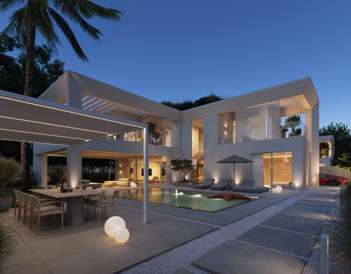 Banusana, a modern villa project in Puerto Banús, featuring sleek white architecture, an illuminated pool, and open-air living spaces at dusk.