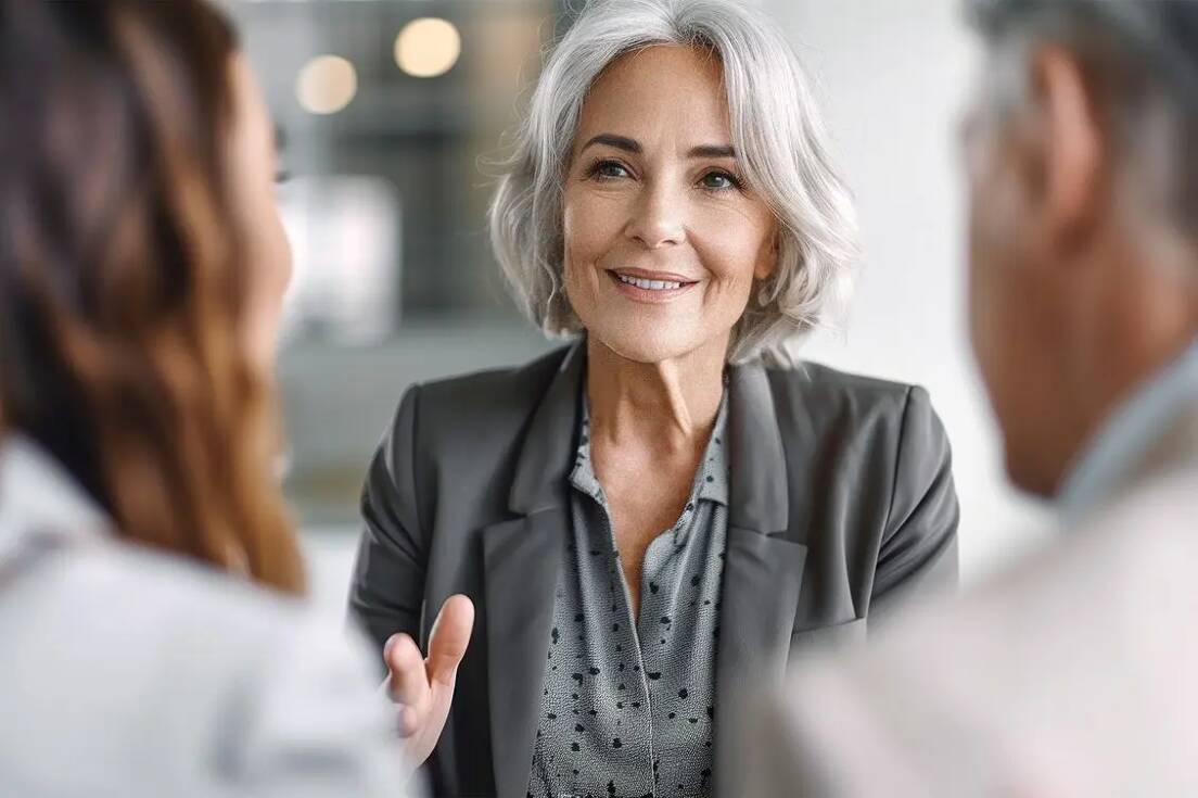 Real estate agent talking with clients
