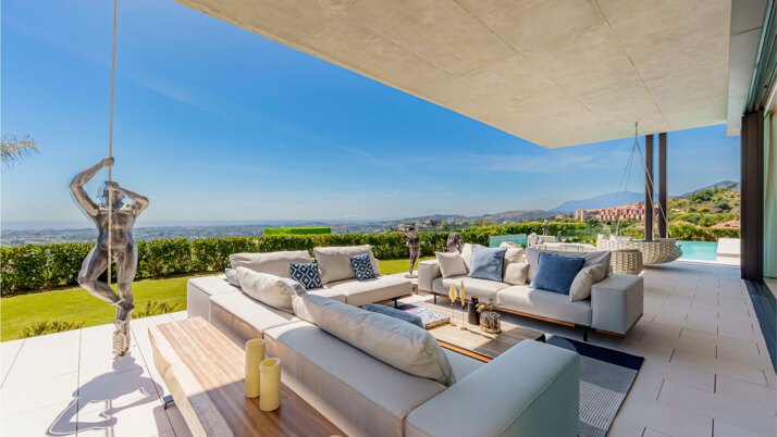 Luxury villa terrace with outdoor lounge and sea views in Marbella, Costa del Sol