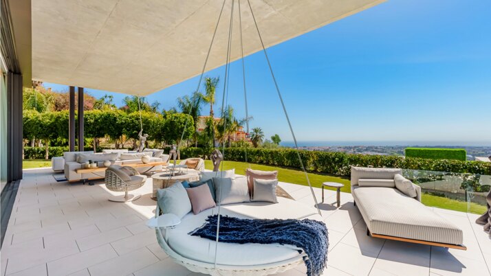 Luxury villa terrace with outdoor lounge and sea views in Marbella, Costa del Sol