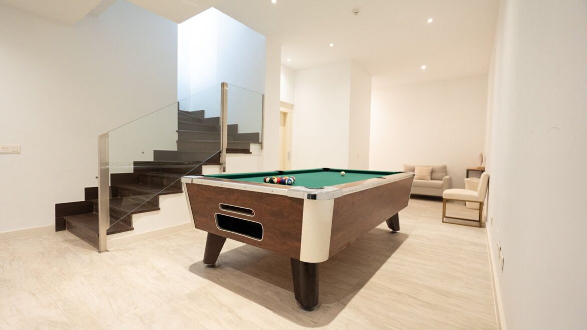 Basement games room in a Vistas Marinas townhouse