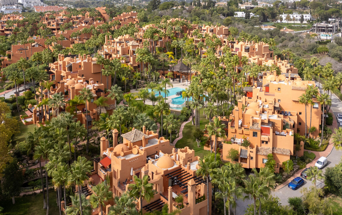 Aerial view of La Alzambra apartments and tropical gardens in Nueva Andalucía, Marbella