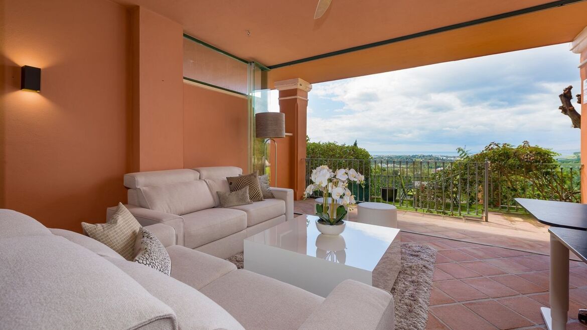 Covered terrace sitting area with garden views in Monte Halcones
