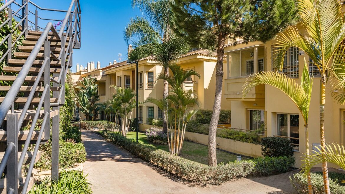 Classical Andalusian buildings and communal gardens at Condado de Sierra Blanca