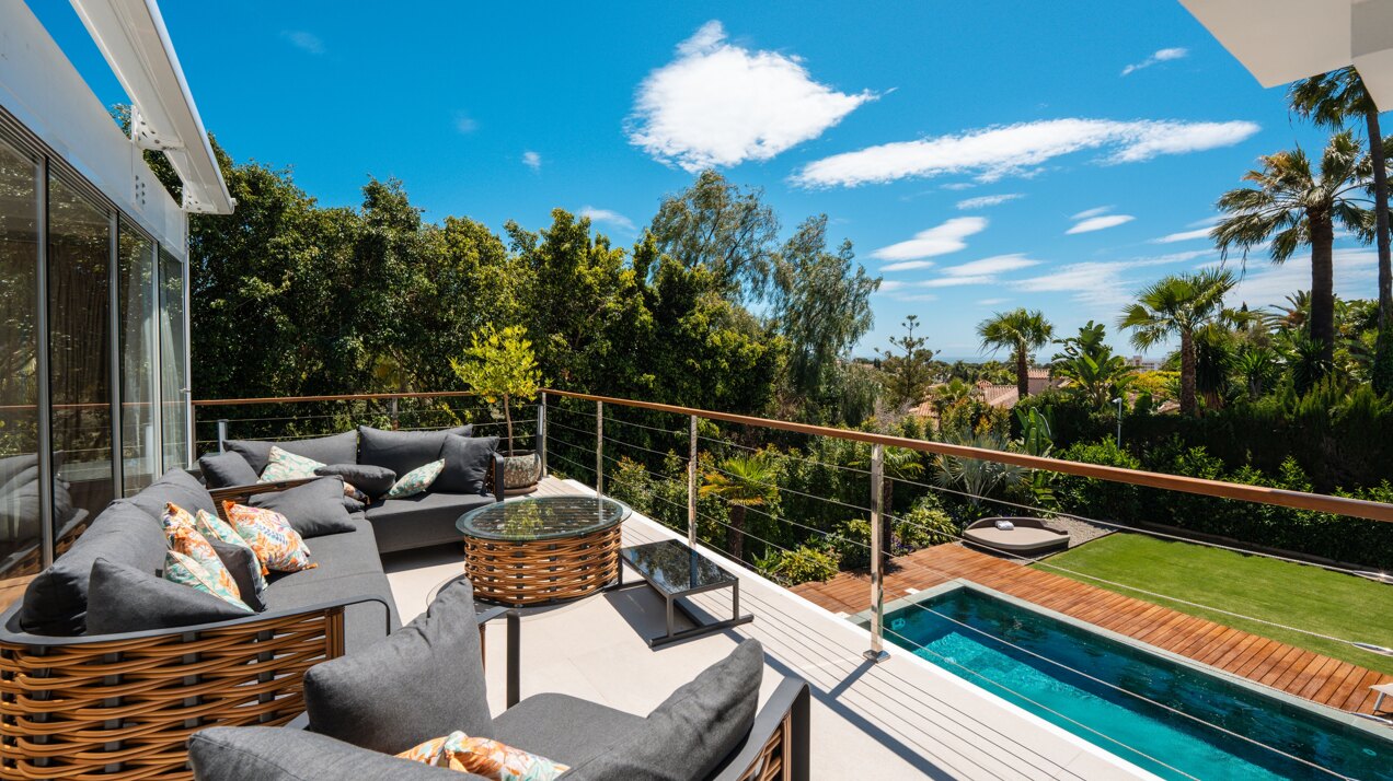 Impressive perfectly renovated villa exhibits exceptional style and charm in sought after El Rosario