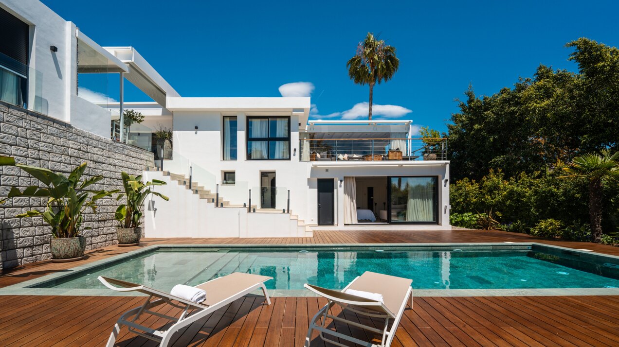 Impressive perfectly renovated villa exhibits exceptional style and charm in sought after El Rosario