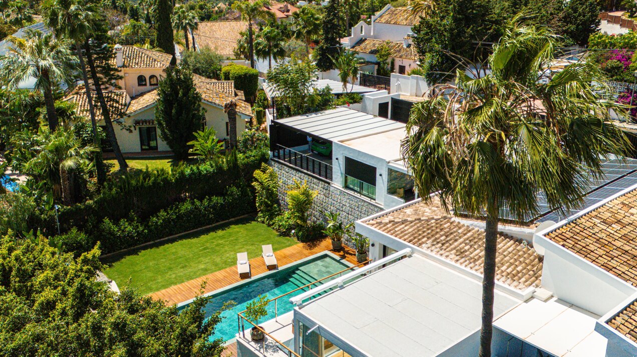 Impressive perfectly renovated villa exhibits exceptional style and charm in sought after El Rosario