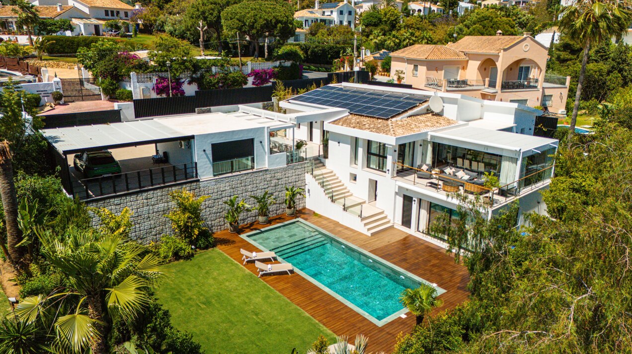 Impressive perfectly renovated villa exhibits exceptional style and charm in sought after El Rosario