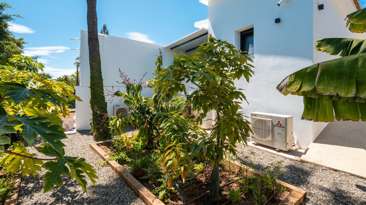Impressive perfectly renovated villa exhibits exceptional style and charm in sought after El Rosario
