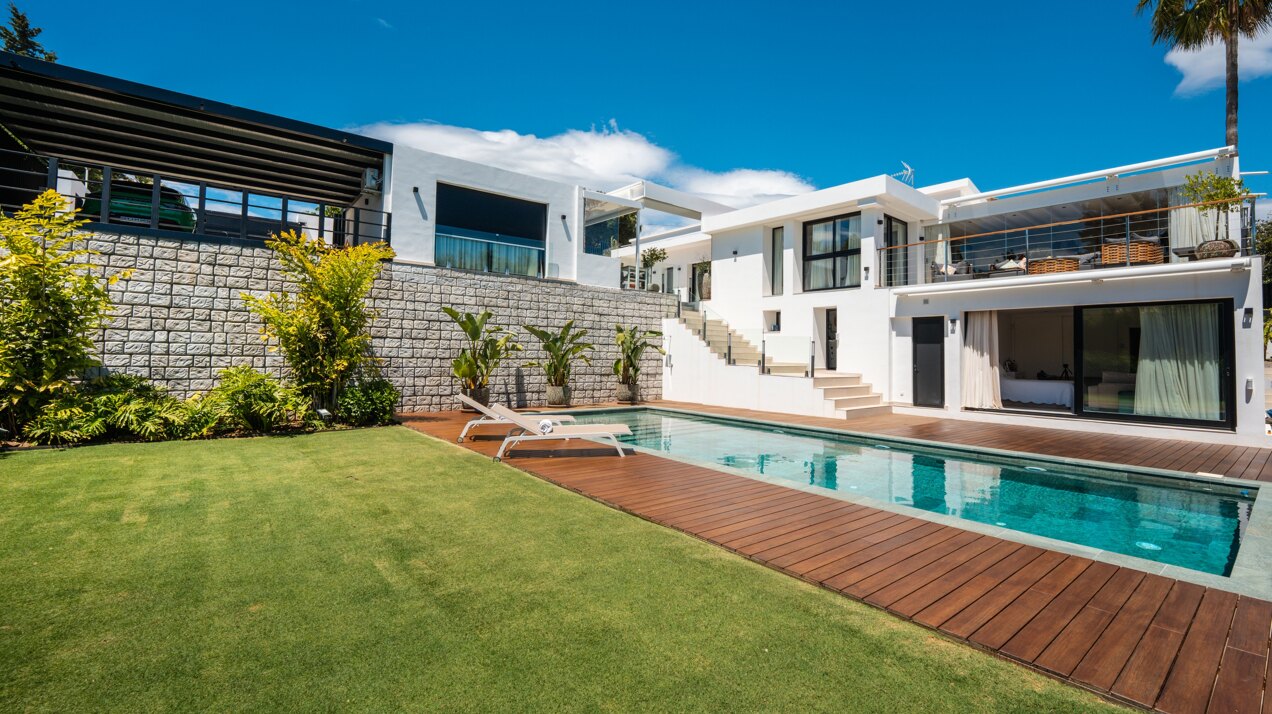 Impressive perfectly renovated villa exhibits exceptional style and charm in sought after El Rosario