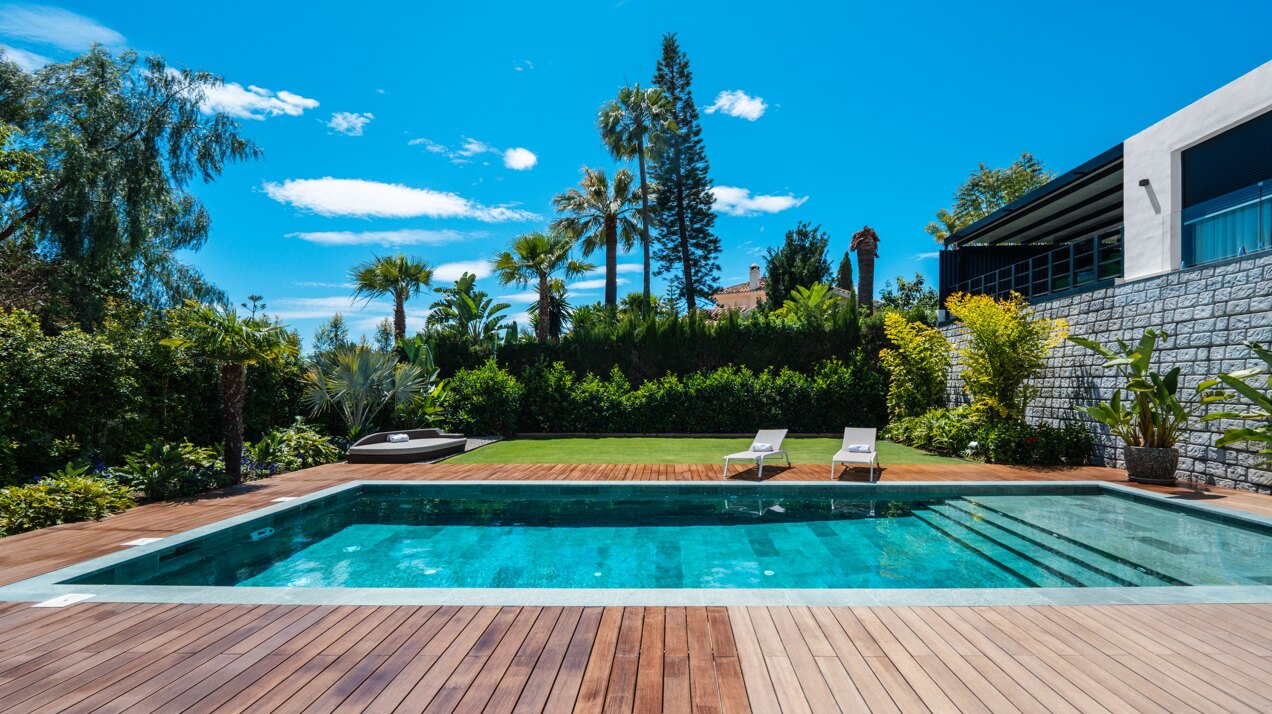 Impressive perfectly renovated villa exhibits exceptional style and charm in sought after El Rosario
