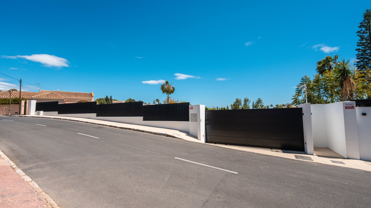 Impressive perfectly renovated villa exhibits exceptional style and charm in sought after El Rosario