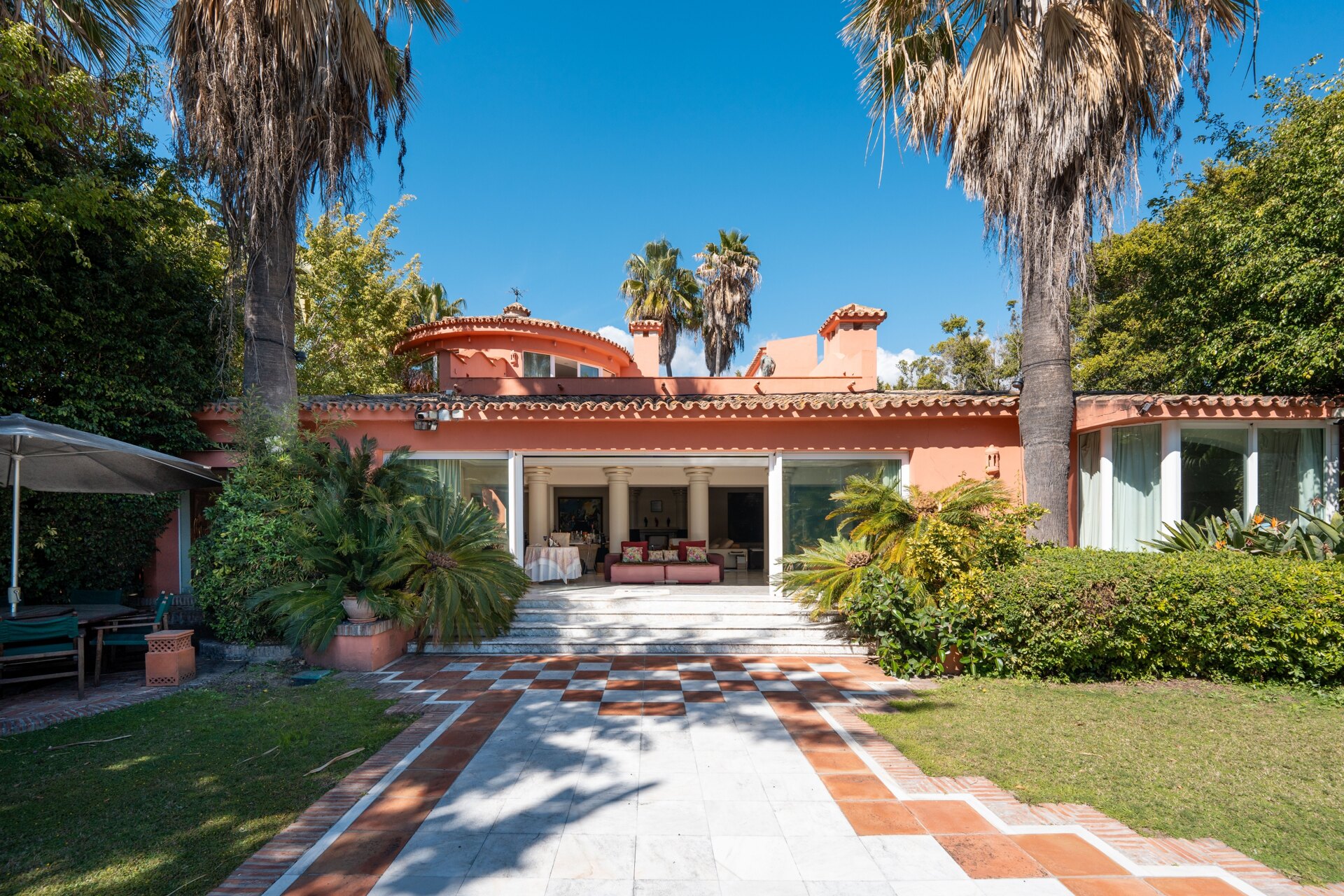 Secluded stately mansion languishes amidst subtropical gardens in the heart of Marbella.