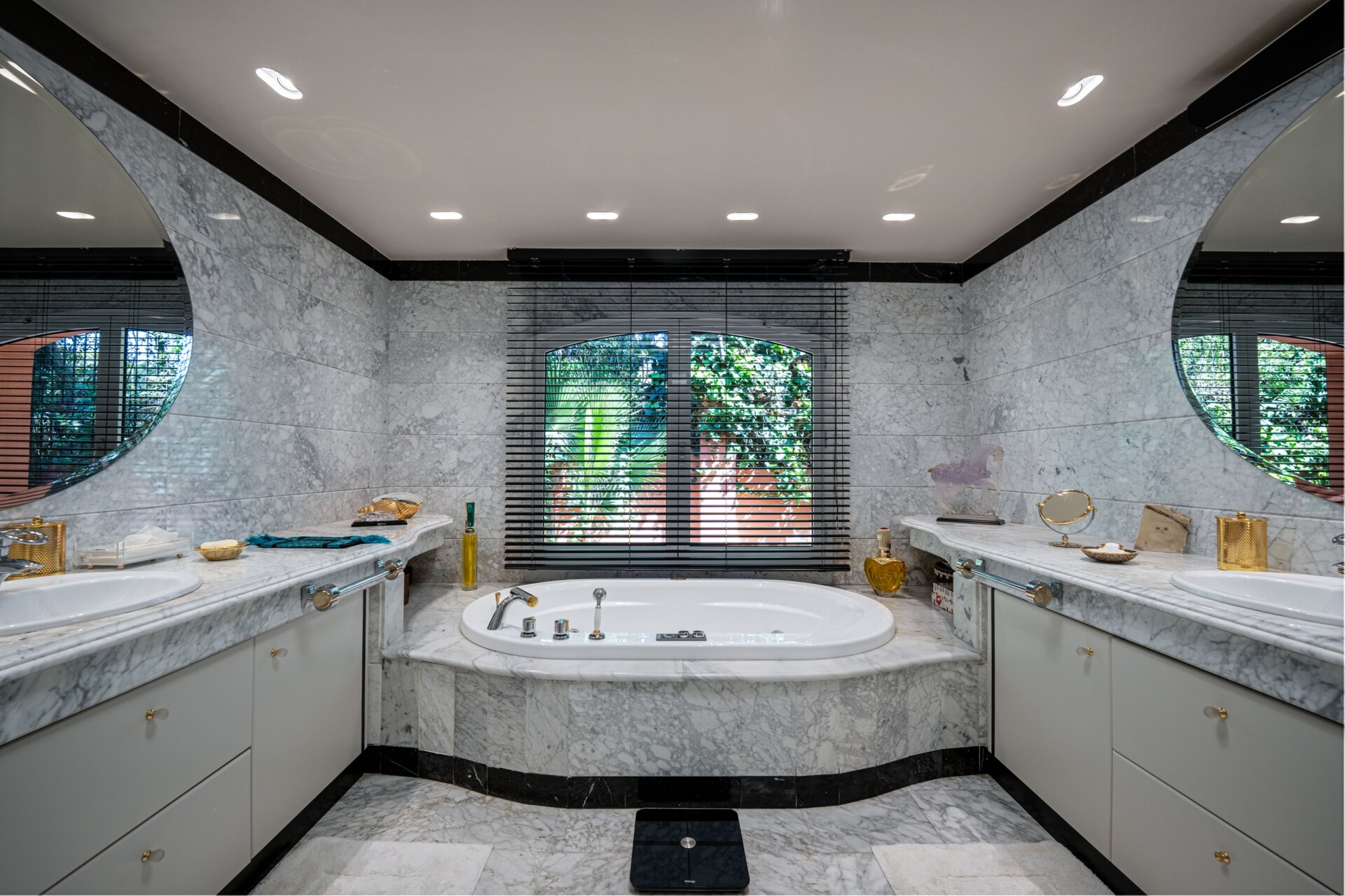 Secluded stately mansion languishes amidst subtropical gardens in the heart of Marbella.