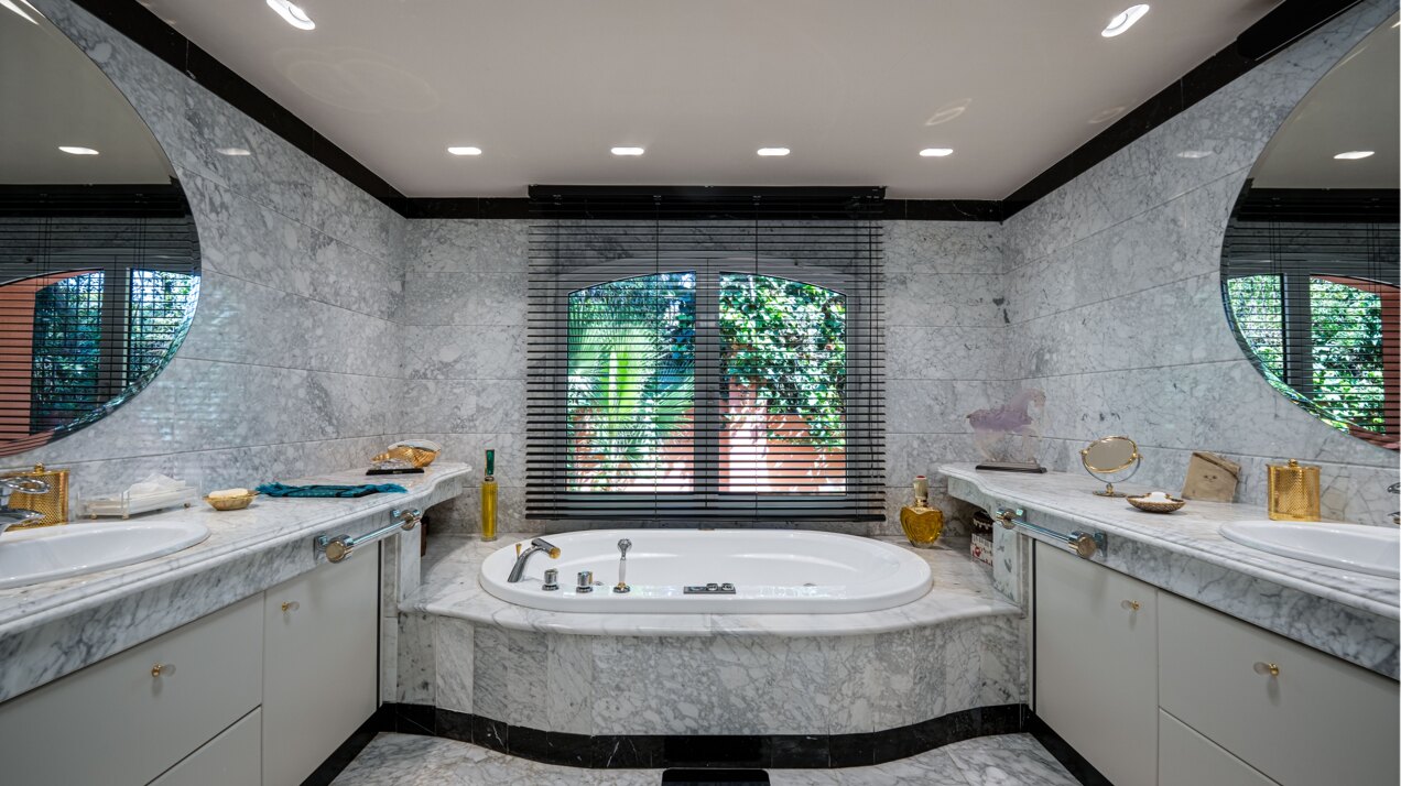 Secluded stately mansion languishes amidst subtropical gardens in the heart of Marbella.