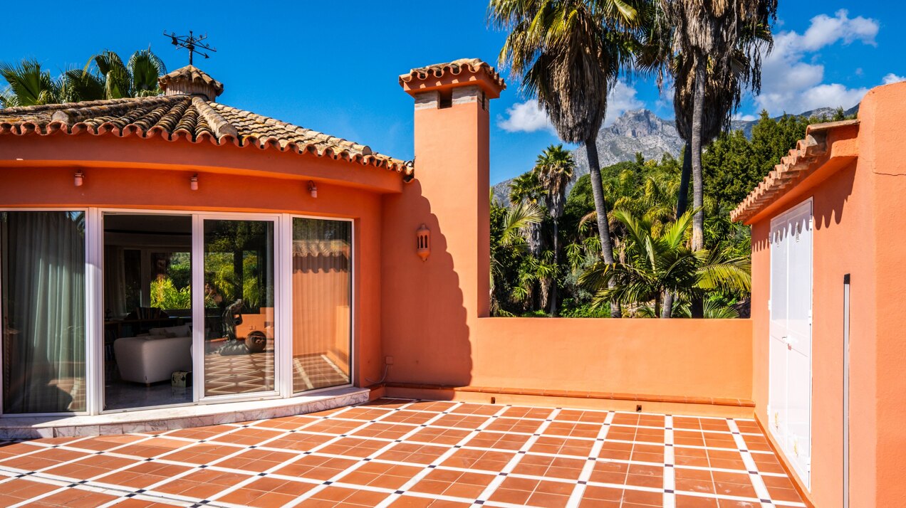 Secluded stately mansion languishes amidst subtropical gardens in the heart of Marbella.