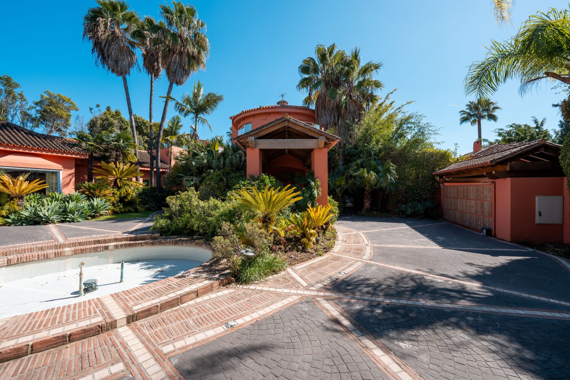 Secluded stately mansion languishes amidst subtropical gardens in the heart of Marbella.