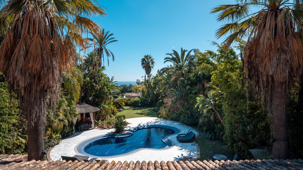 Secluded stately mansion languishes amidst subtropical gardens in the heart of Marbella.