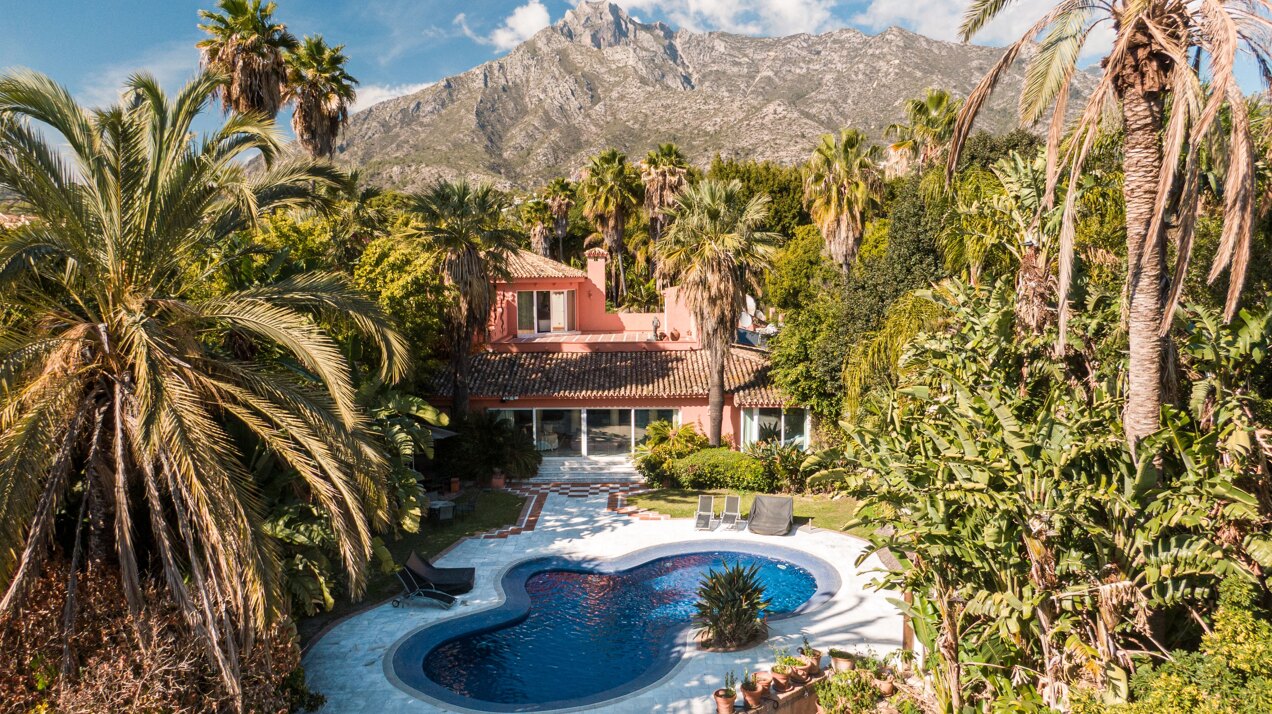 Secluded stately mansion languishes amidst subtropical gardens in the heart of Marbella.