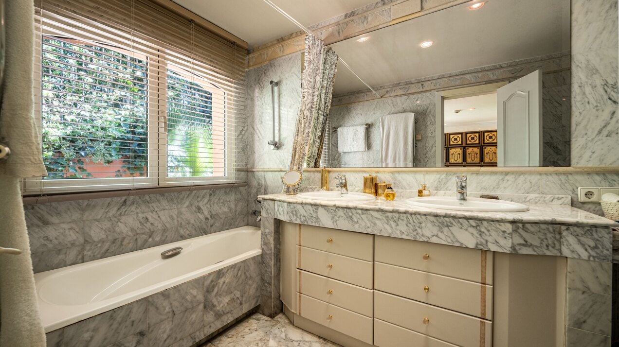 Secluded stately mansion languishes amidst subtropical gardens in the heart of Marbella.