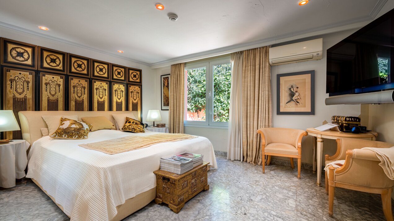 Secluded stately mansion languishes amidst subtropical gardens in the heart of Marbella.