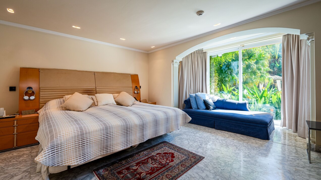 Secluded stately mansion languishes amidst subtropical gardens in the heart of Marbella.