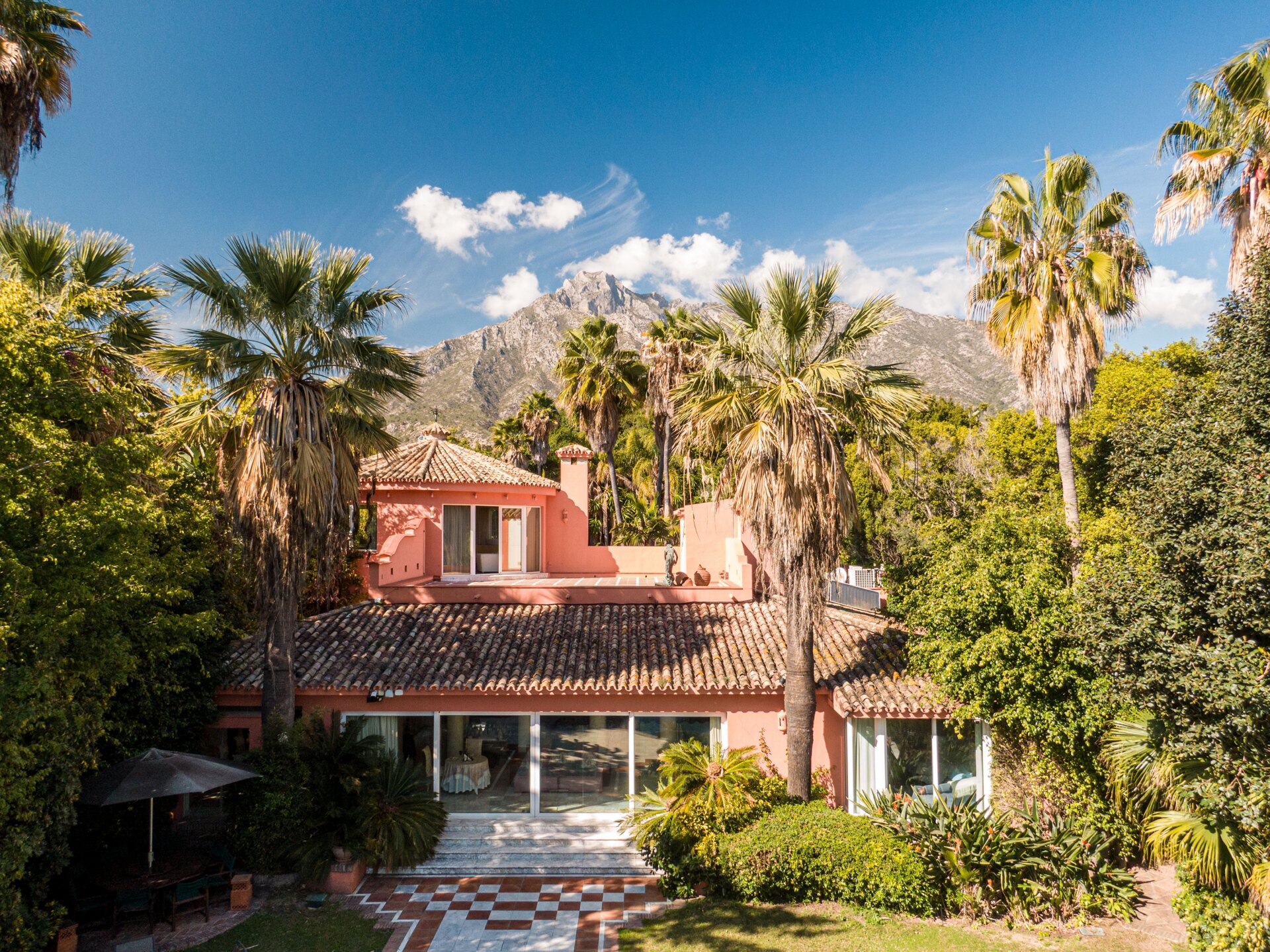 Secluded stately mansion languishes amidst subtropical gardens in the heart of Marbella.